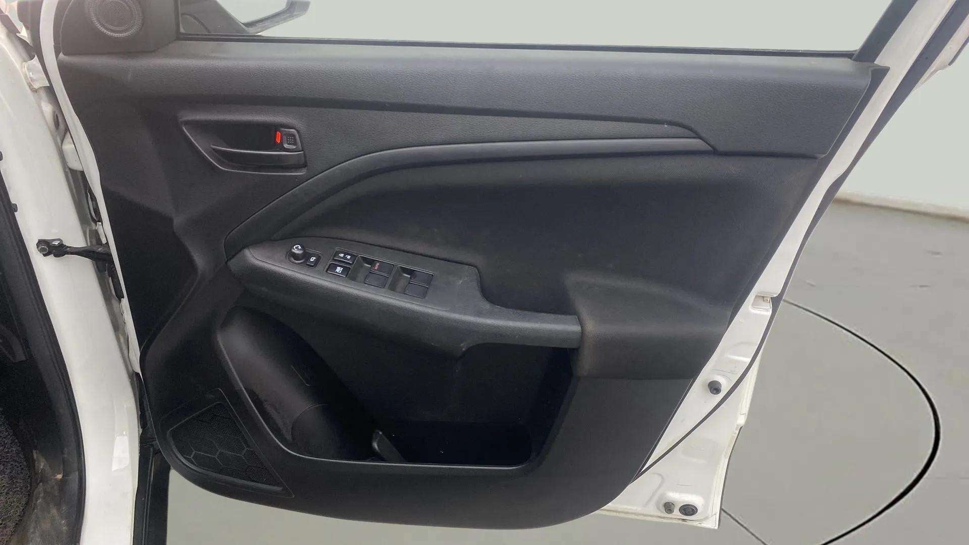 Interior driver side door panel of a Maruti Suzuki Brezza