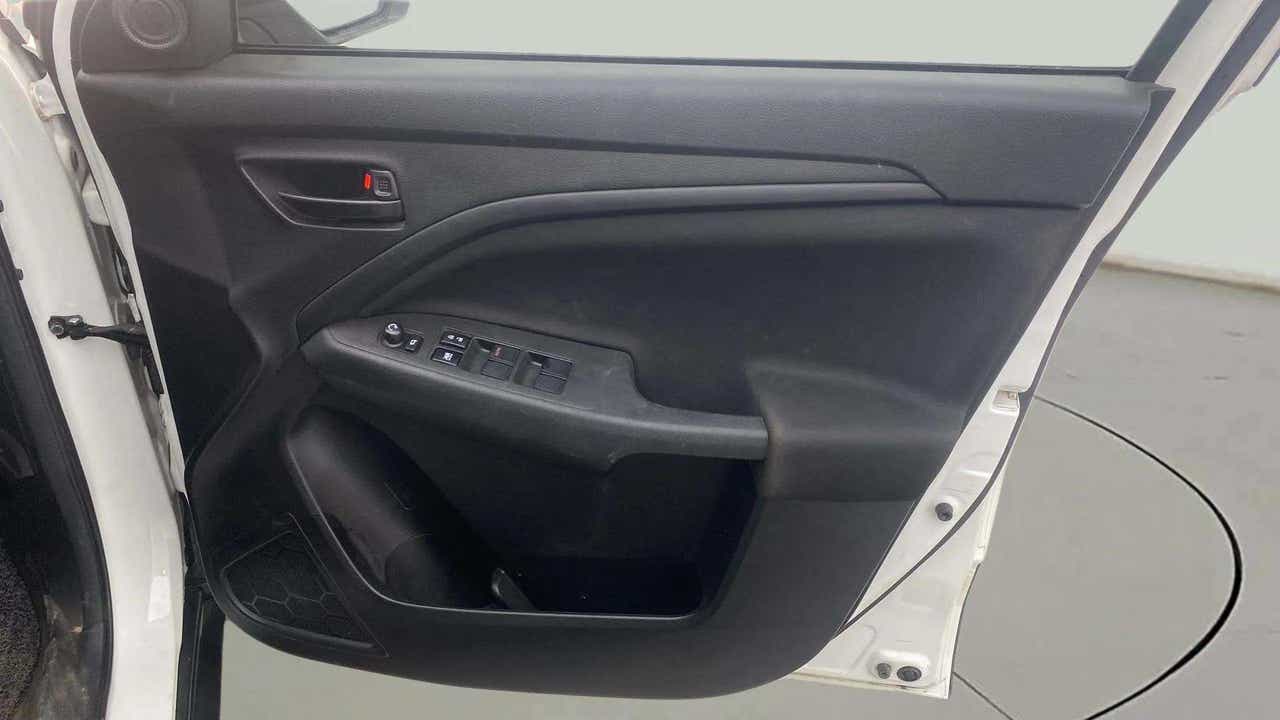Interior driver side door panel of a Maruti Suzuki Brezza