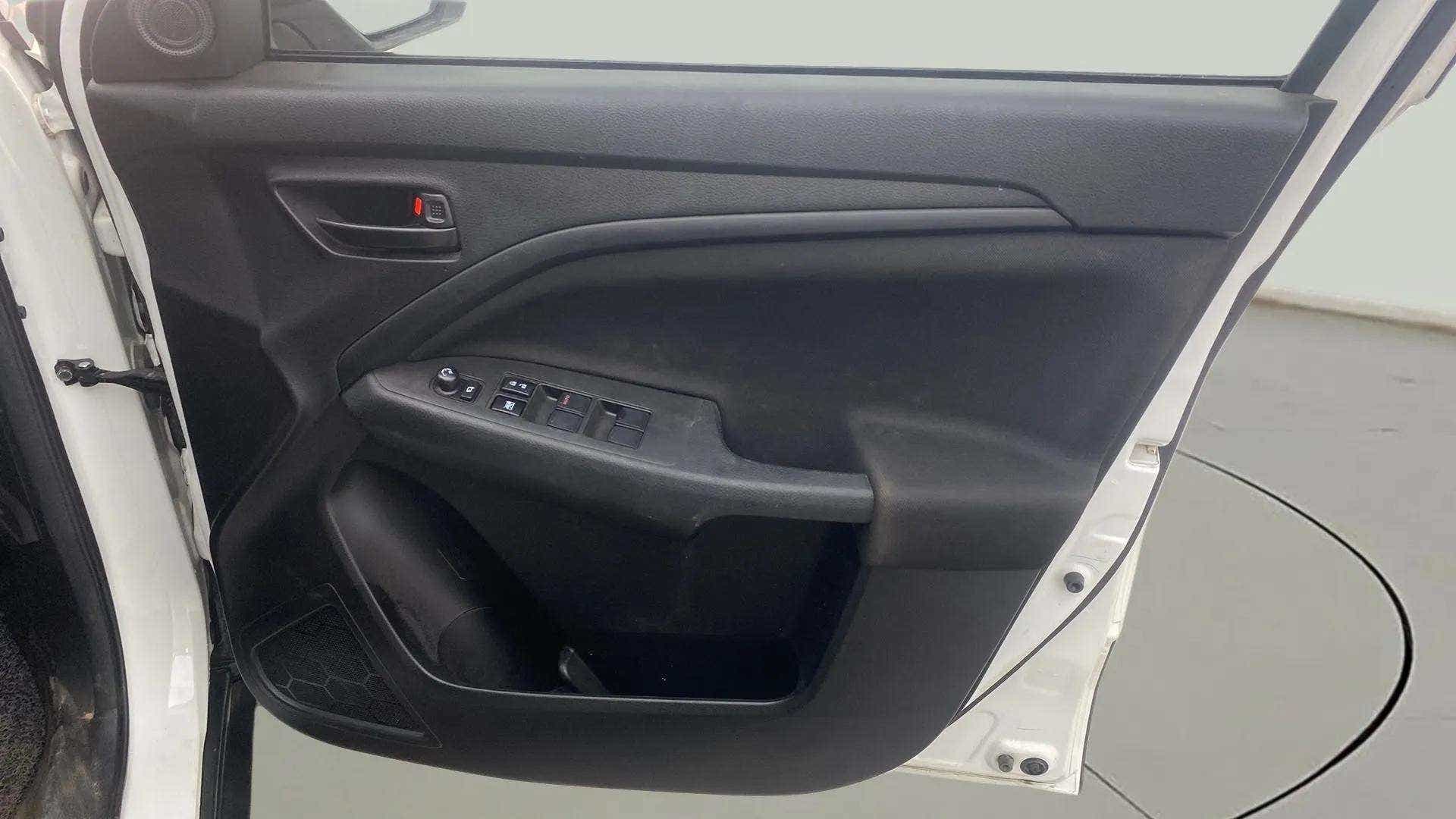 Interior driver side door panel of a Maruti Suzuki Brezza