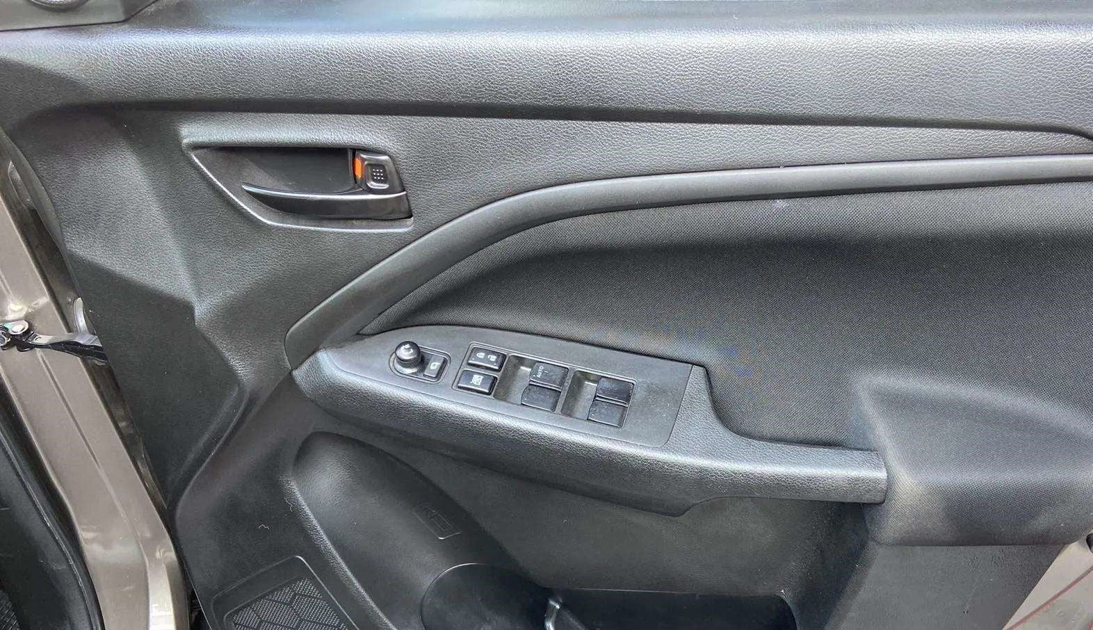 Driver side door panel of a Maruti Suzuki Brezza