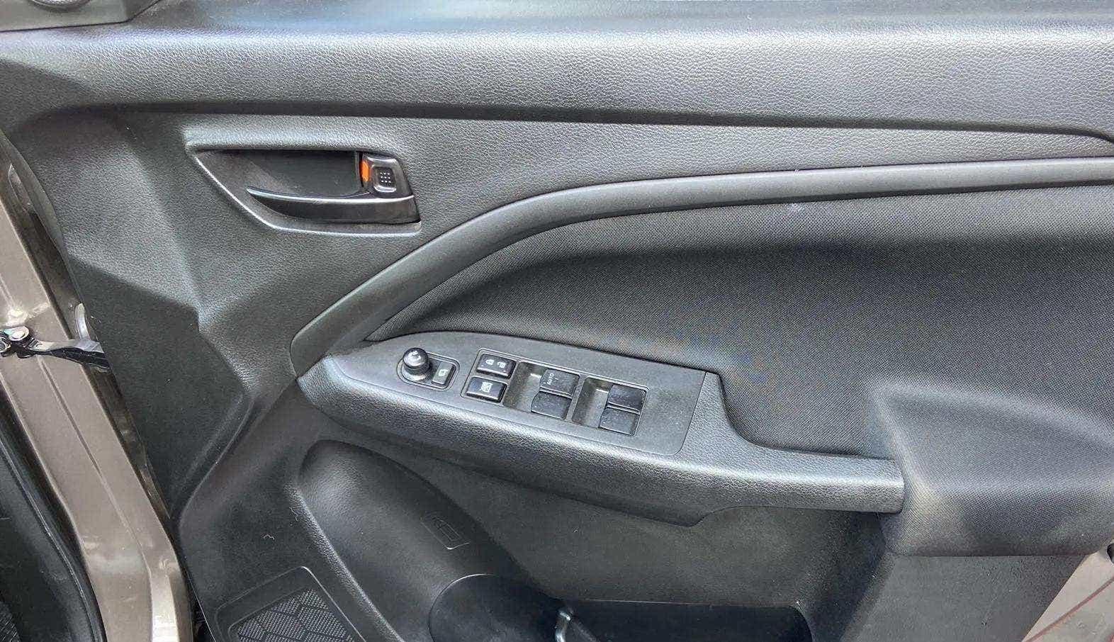 Driver side door panel of a Maruti Suzuki Brezza
