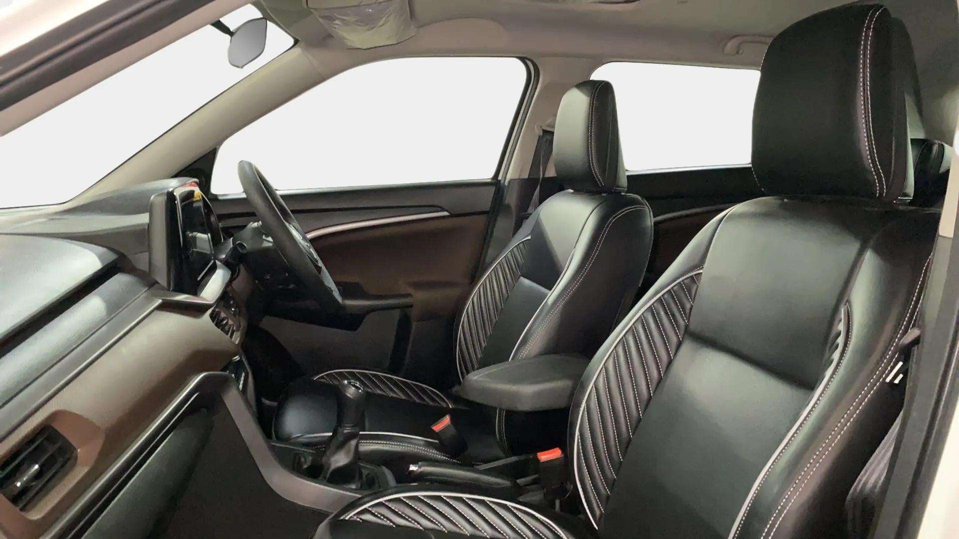 Front interior seats and dashboard of a Maruti Suzuki Brezza