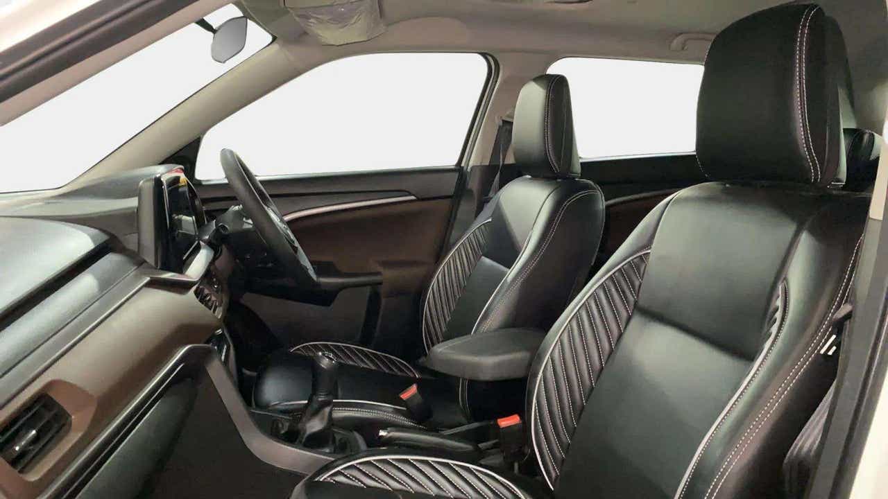 Front interior seats and dashboard of a Maruti Suzuki Brezza