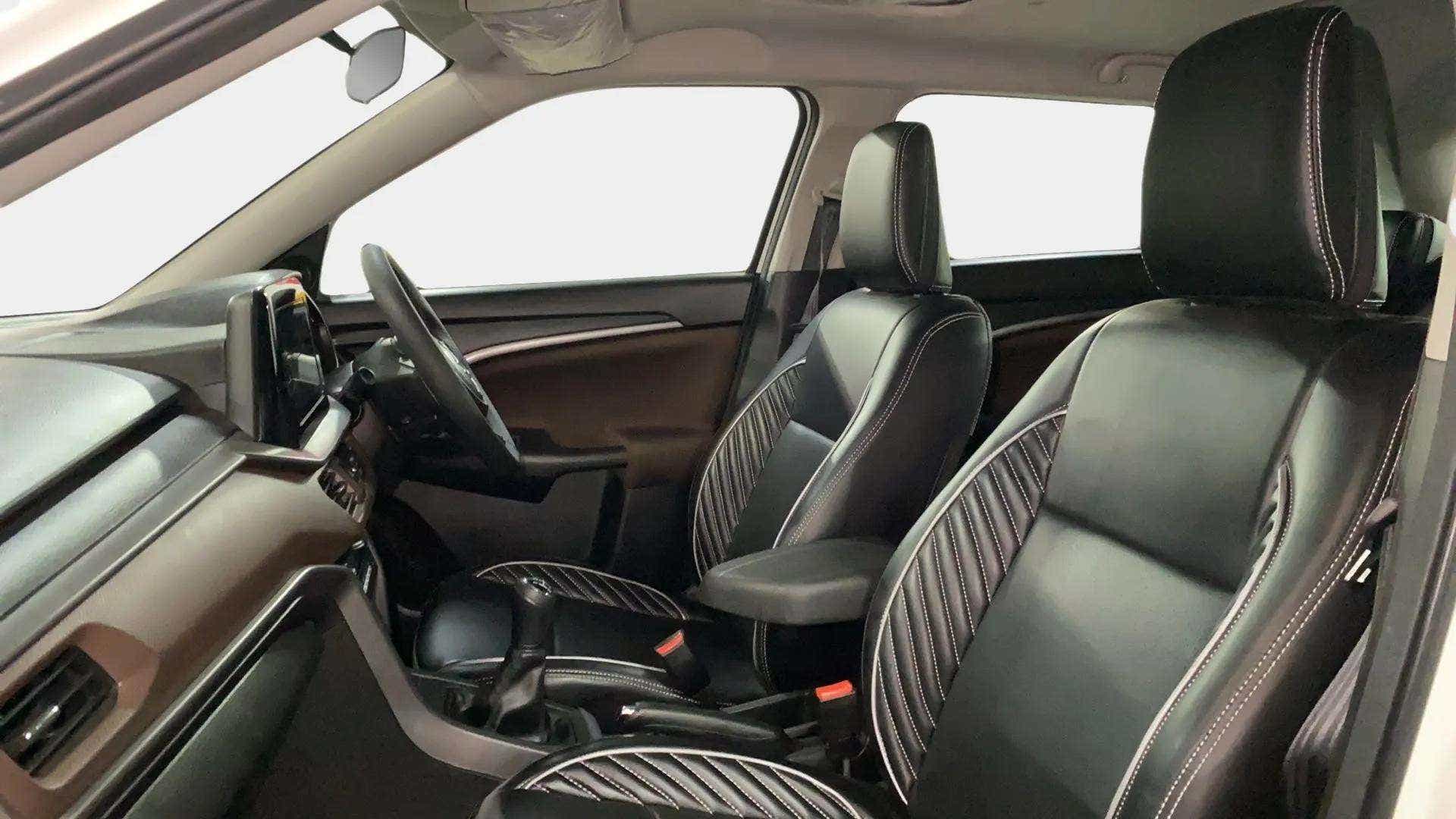 Front interior seats and dashboard of a Maruti Suzuki Brezza