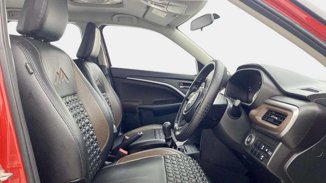 Interior dashboard and front seats of a Maruti Suzuki Brezza