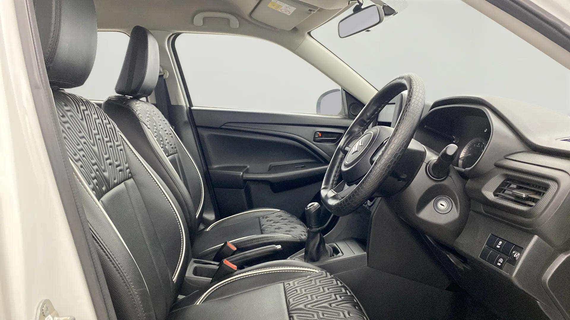 Interior front seats and dashboard of a Maruti Suzuki Brezza