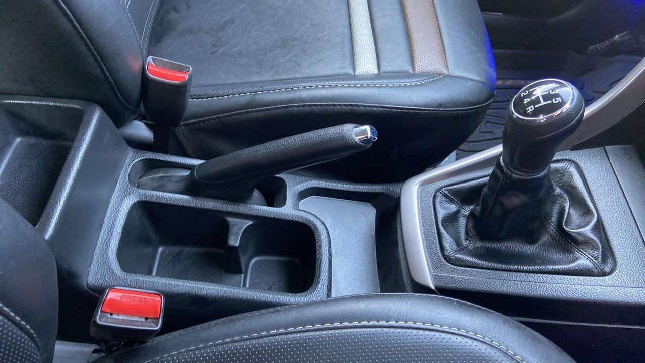 Interior gear lever and handbrake area of a Maruti Suzuki Brezza