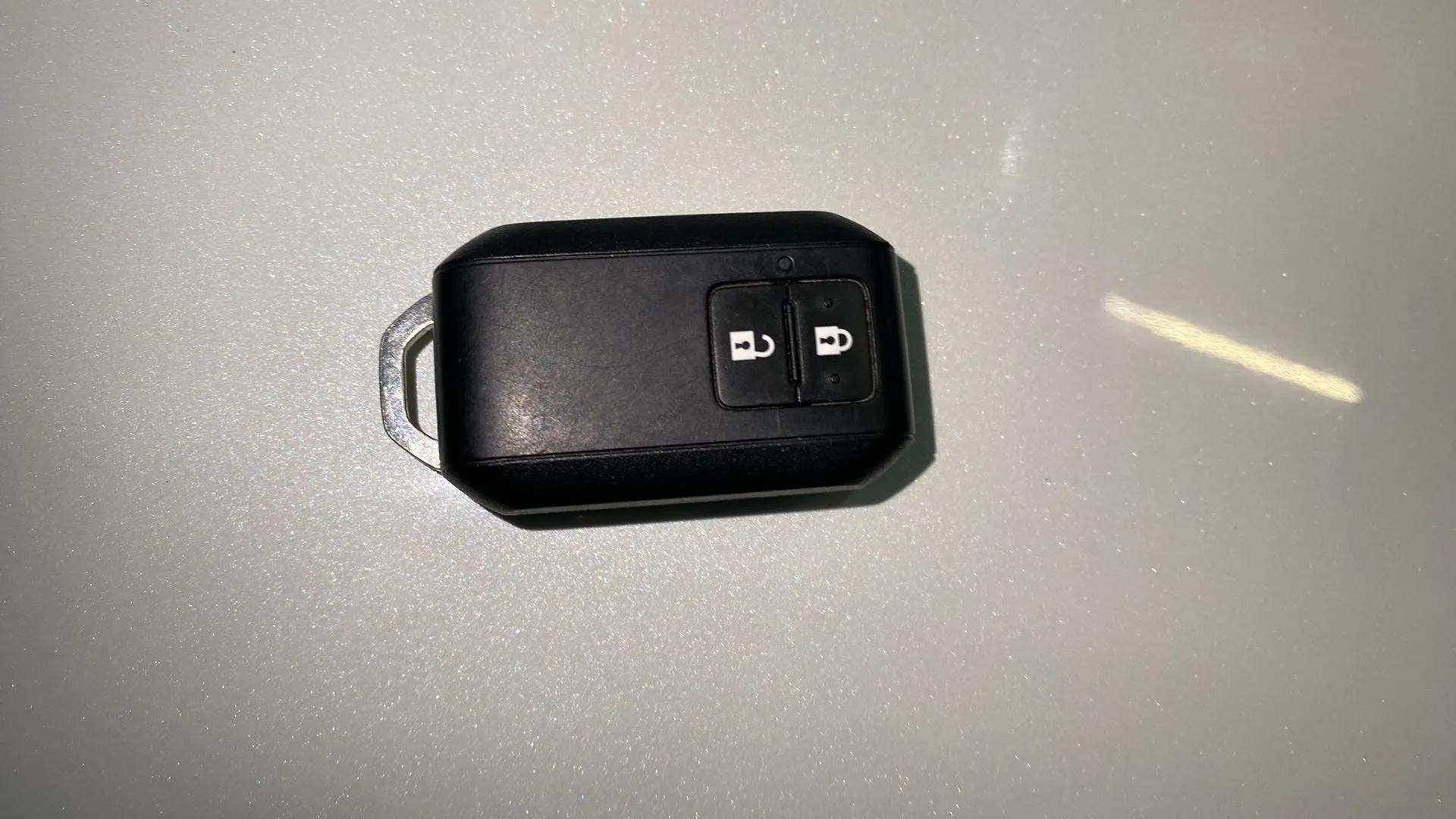 Close-up of a car key fob of a Maruti Suzuki Brezza