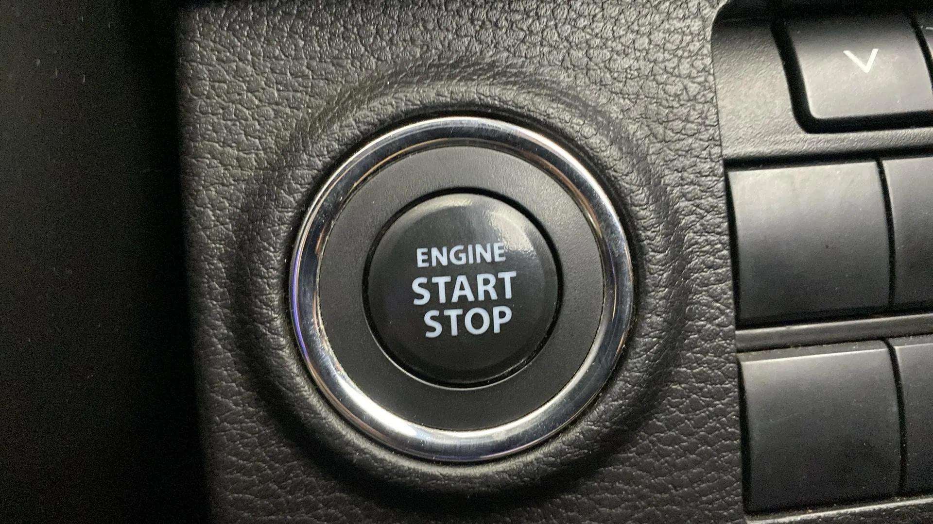 Close-up view of the engine start stop button of a Maruti Suzuki Brezza