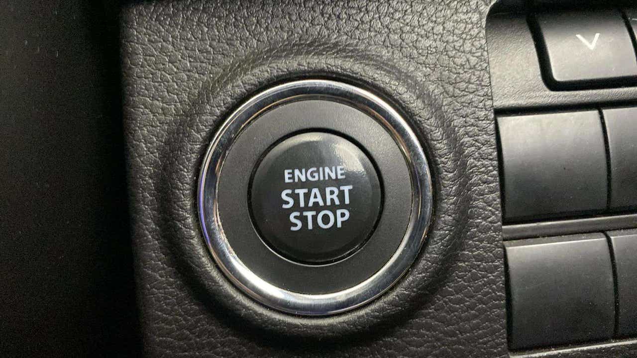 Close-up view of the engine start stop button of a Maruti Suzuki Brezza