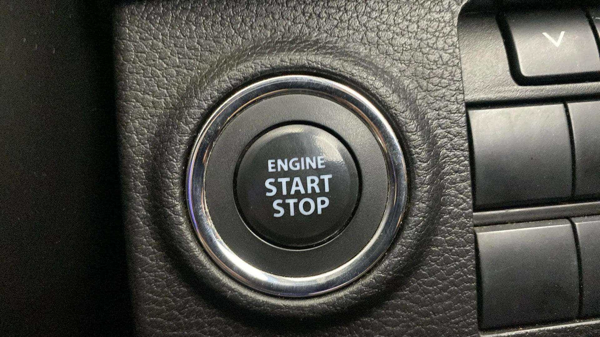 Close-up view of the engine start stop button of a Maruti Suzuki Brezza