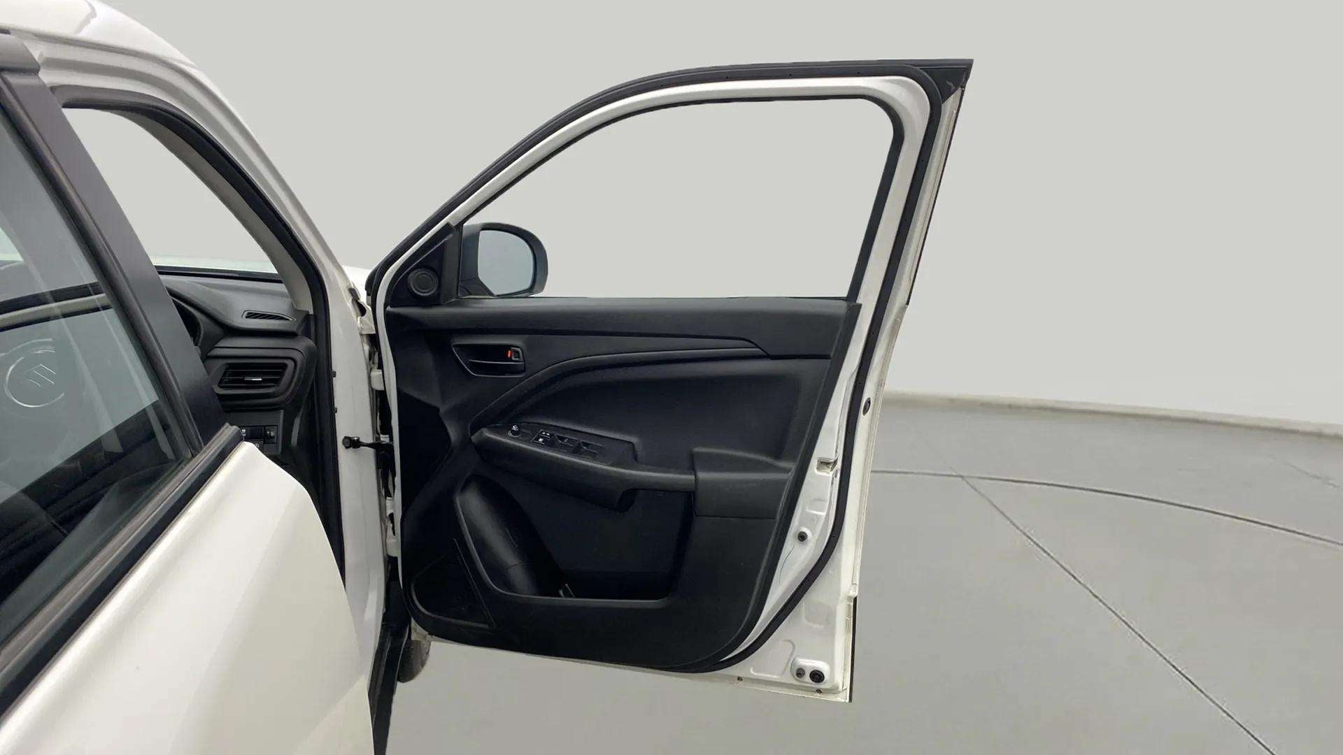 Driver side door panel view of a Maruti Suzuki Brezza