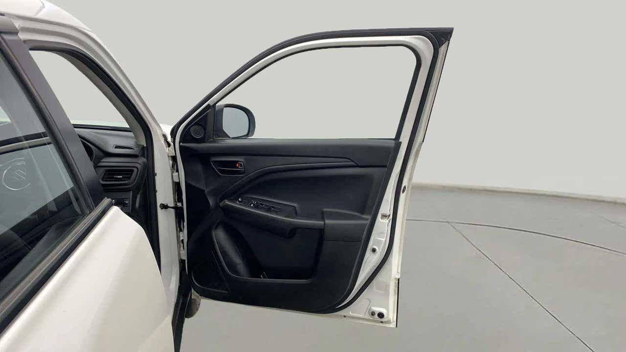 Driver side door panel view of a Maruti Suzuki Brezza
