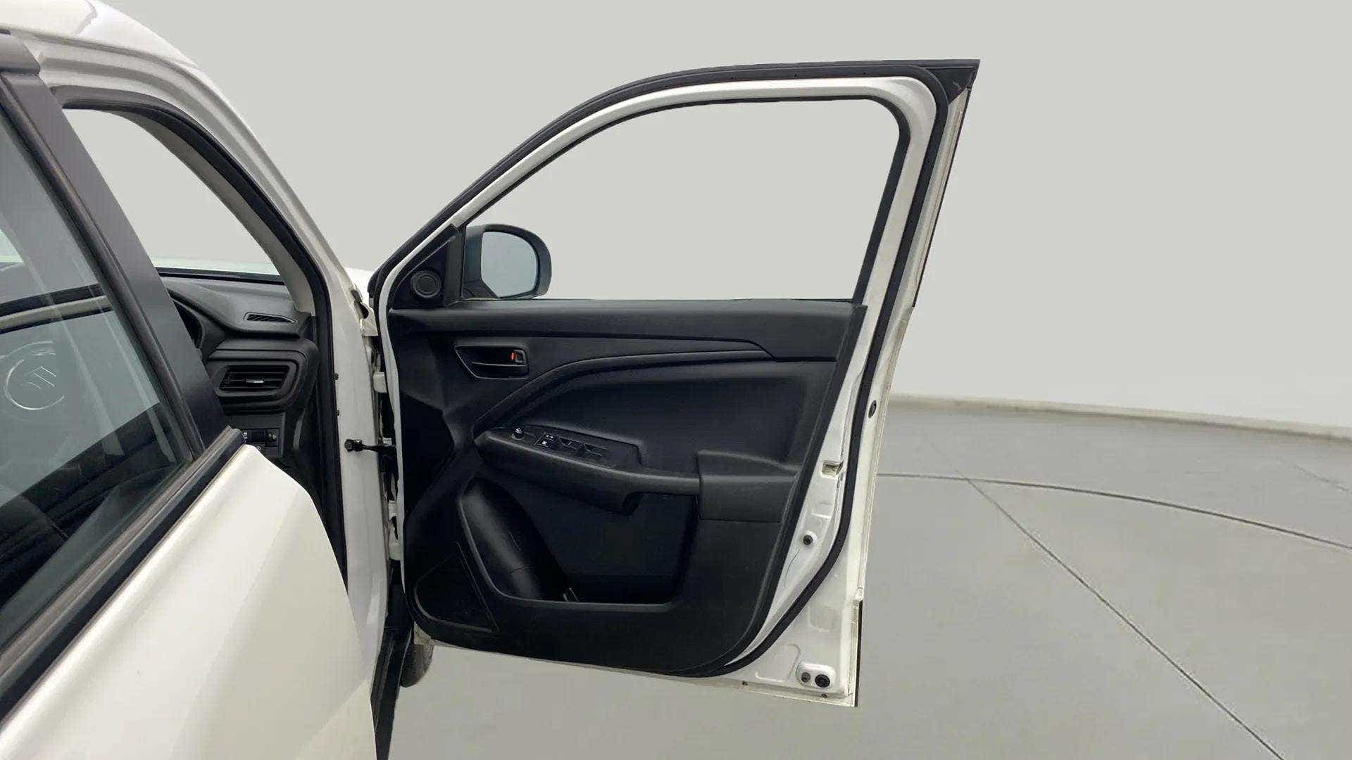 Driver side door panel view of a Maruti Suzuki Brezza