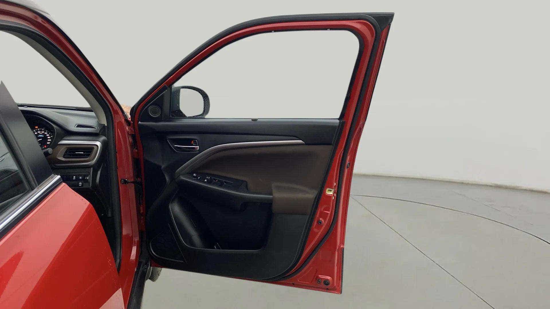 Driver door interior view of a Maruti Suzuki Brezza