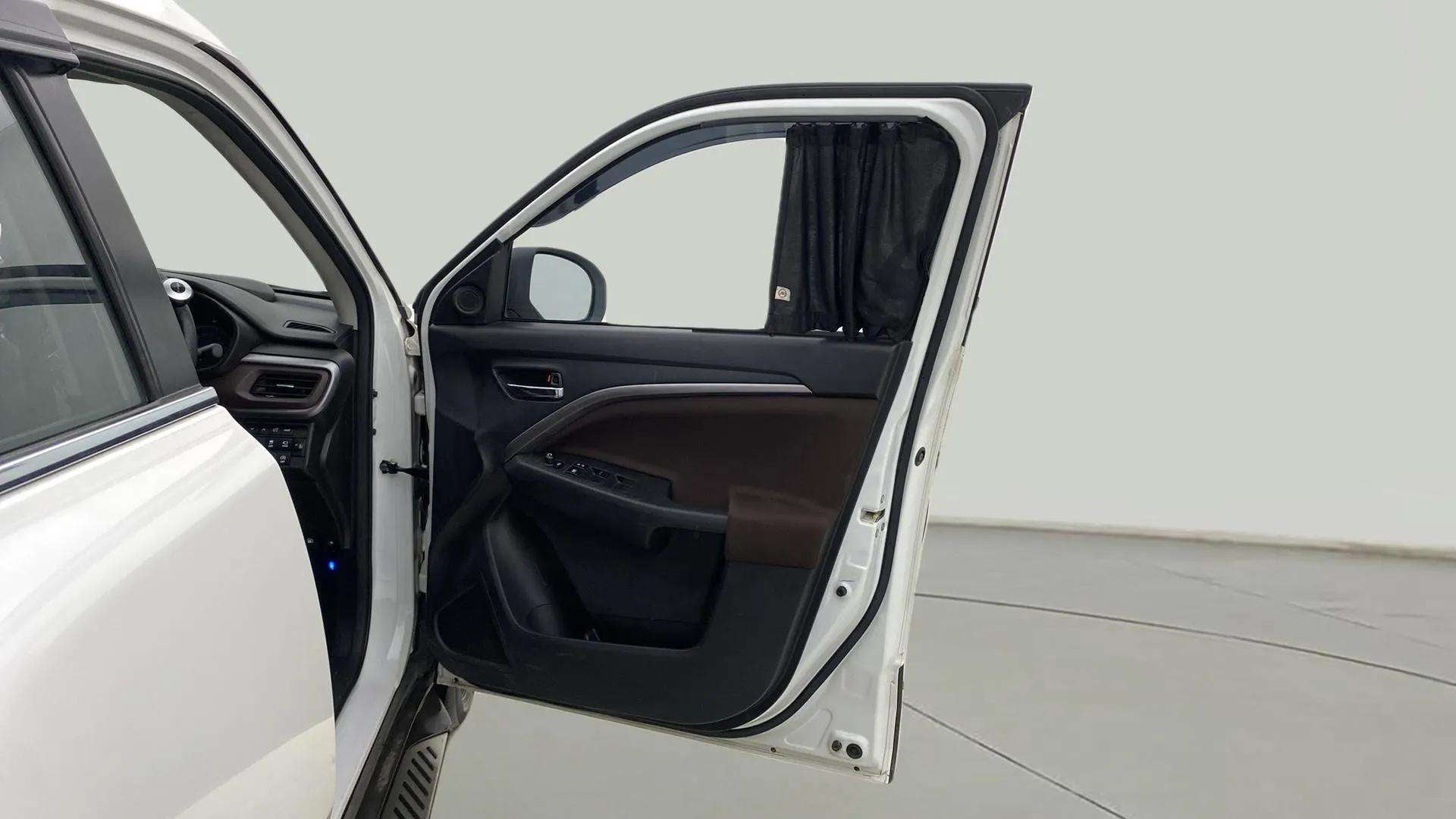 Front door and dashboard view of a Maruti Suzuki Brezza