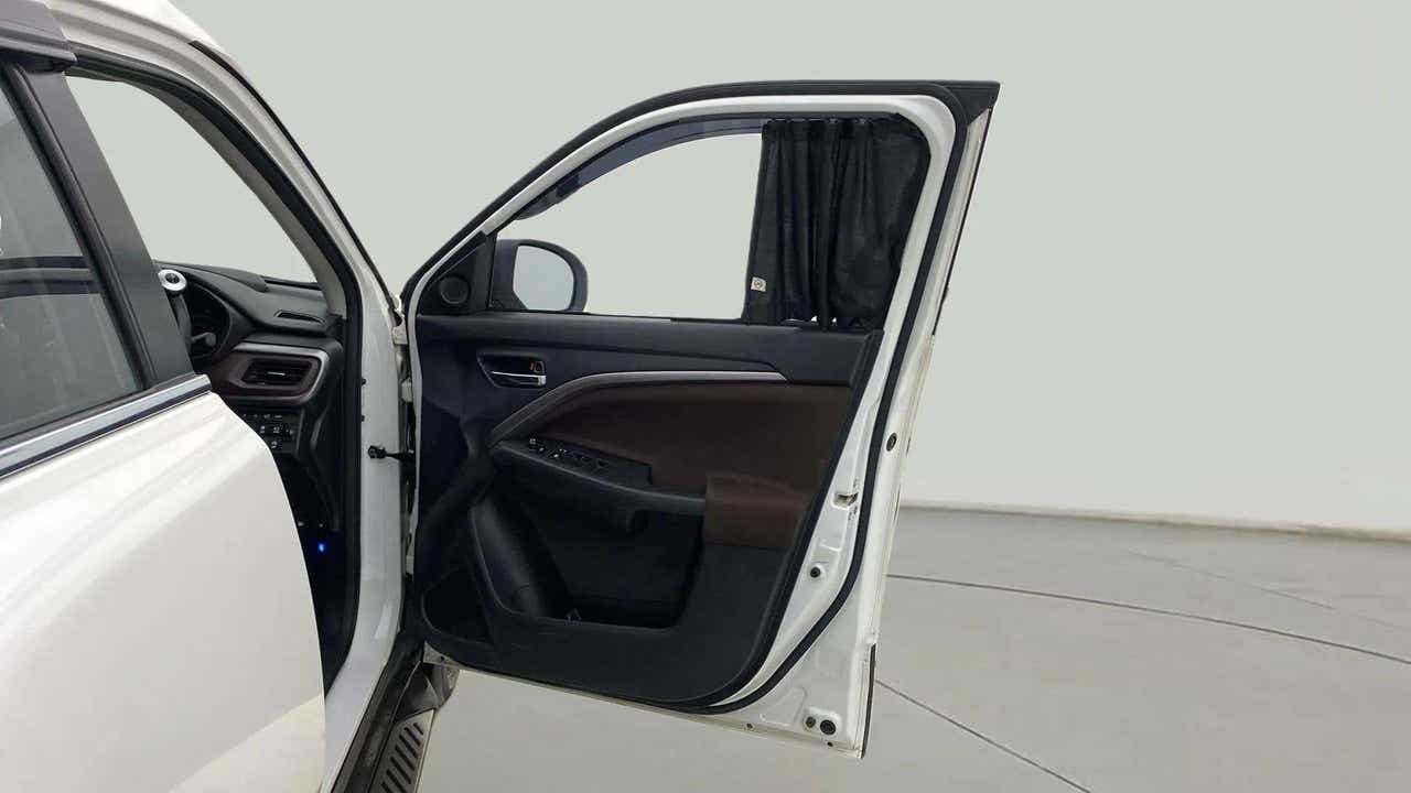 Front door and dashboard view of a Maruti Suzuki Brezza