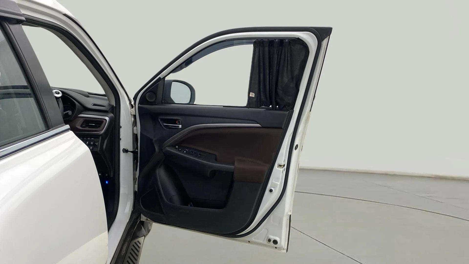Front door and dashboard view of a Maruti Suzuki Brezza