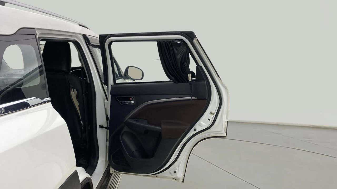 Rear left door open view of a Maruti Suzuki Brezza