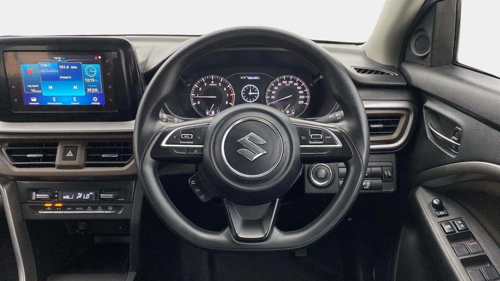 Interior dashboard and steering wheel of a Maruti Suzuki Brezza