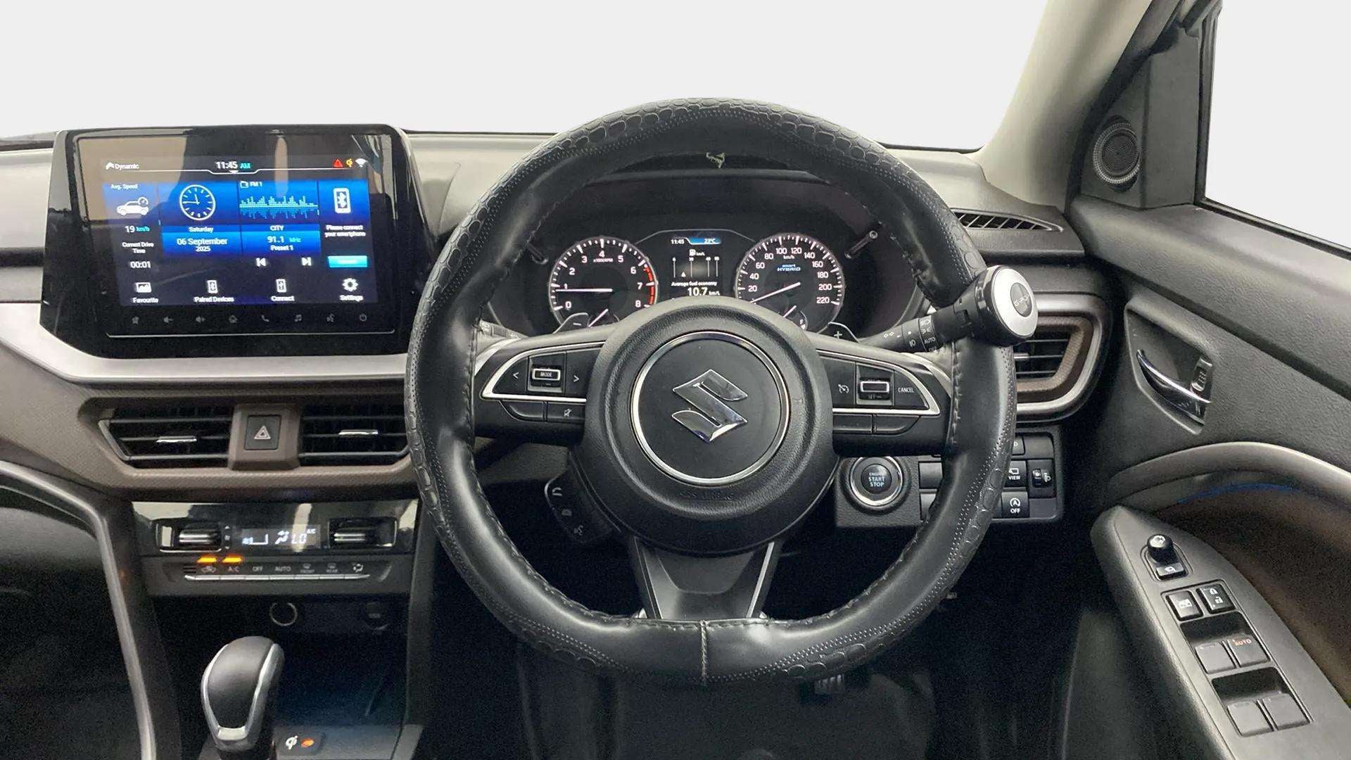 Dashboard and steering wheel of a Maruti Suzuki Brezza