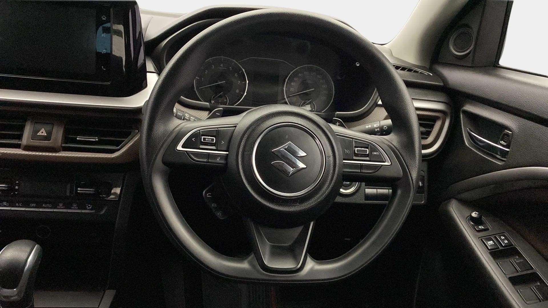 Steering wheel and dashboard of a Maruti Suzuki Brezza