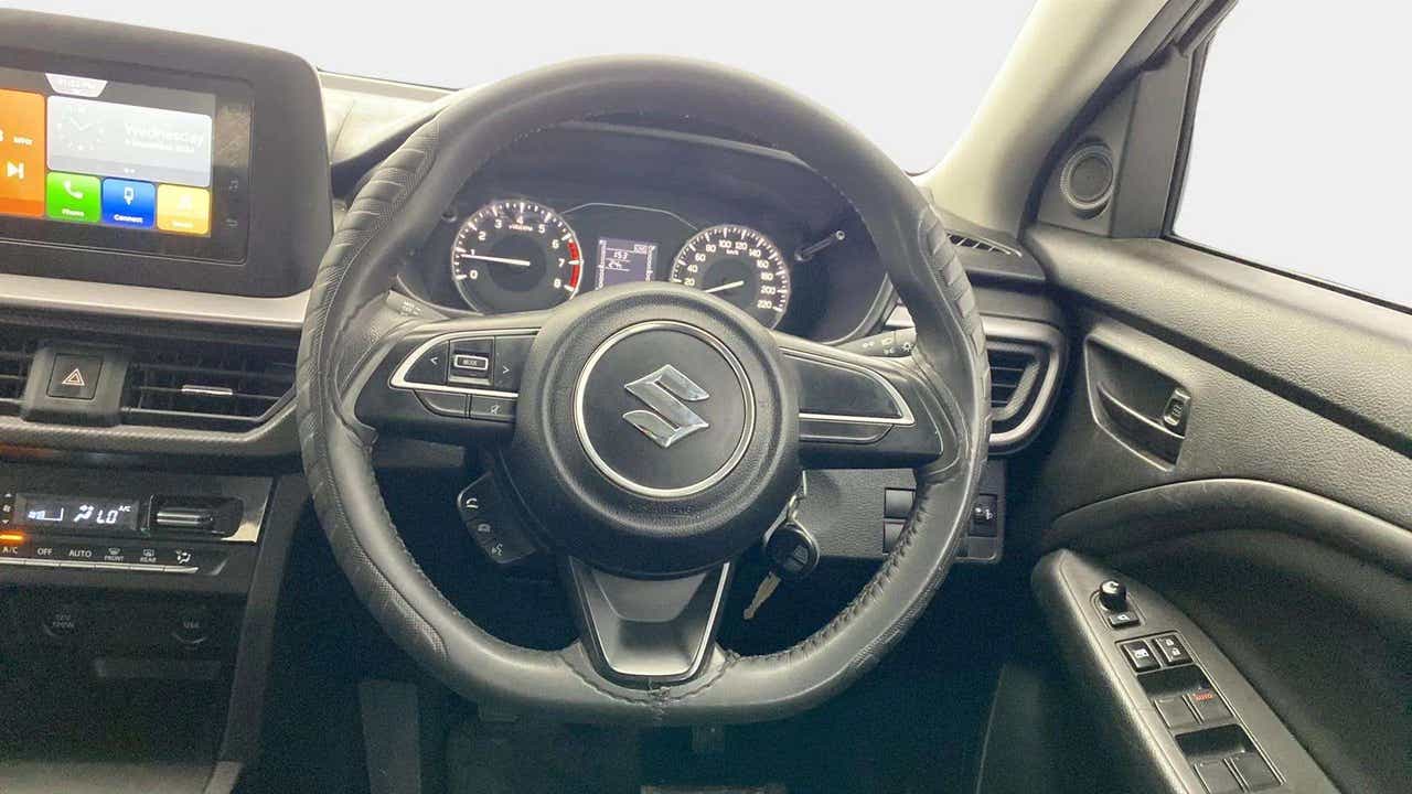Interior driver cockpit view of a Maruti Suzuki Brezza