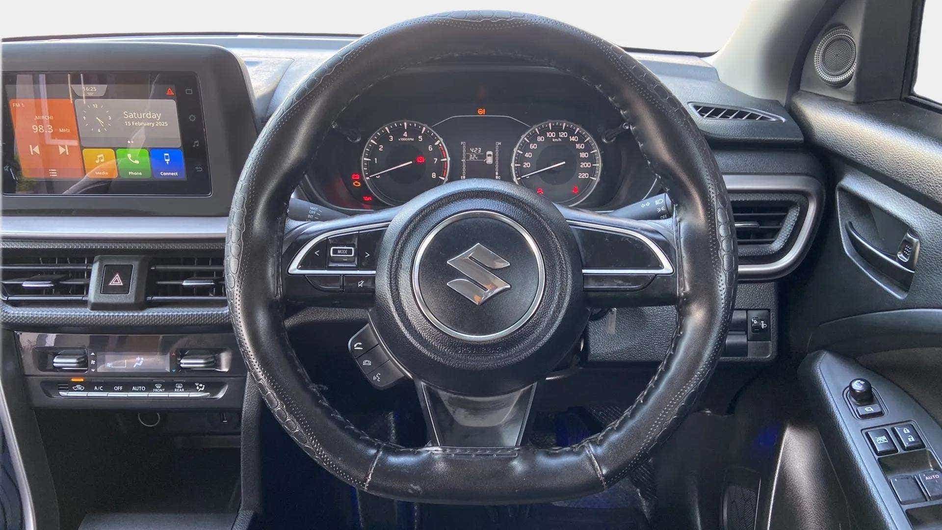 Dashboard and steering wheel of a Maruti Suzuki Brezza