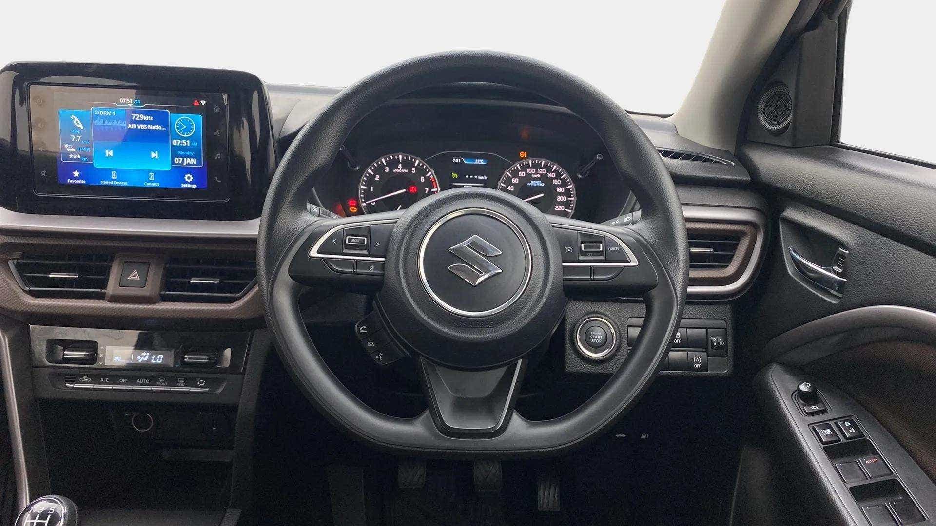 Dashboard and steering wheel of a Maruti Suzuki Brezza