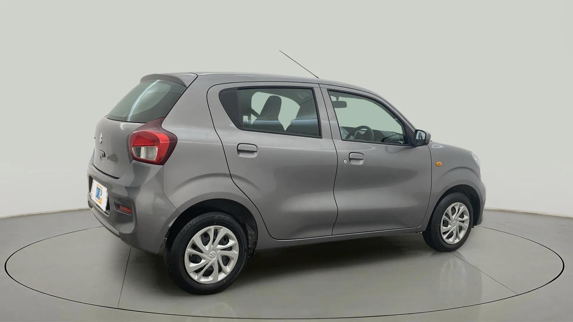 Rear three-quarter of a glistening grey Maruti Suzuki Celerio