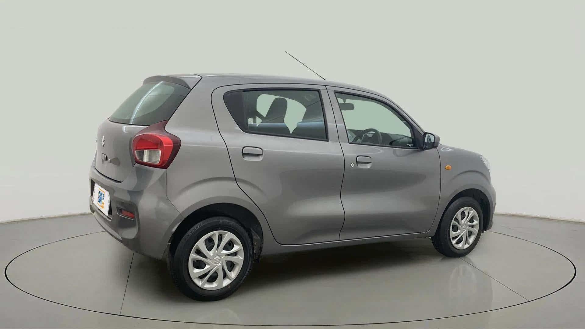 Rear three-quarter of a glistening grey Maruti Suzuki Celerio