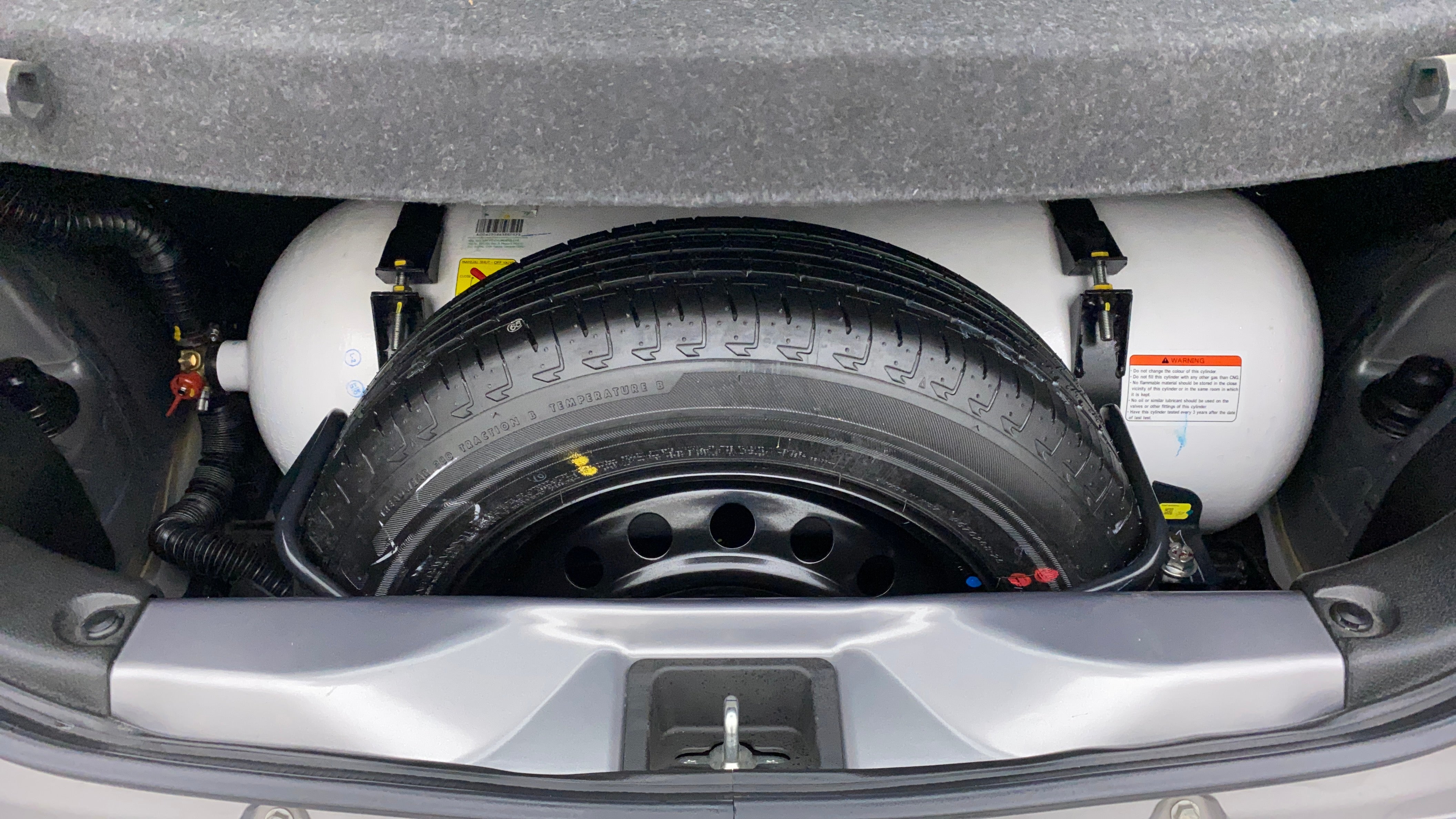 Cng tank and spare wheel in a Maruti Suzuki Celerio boot