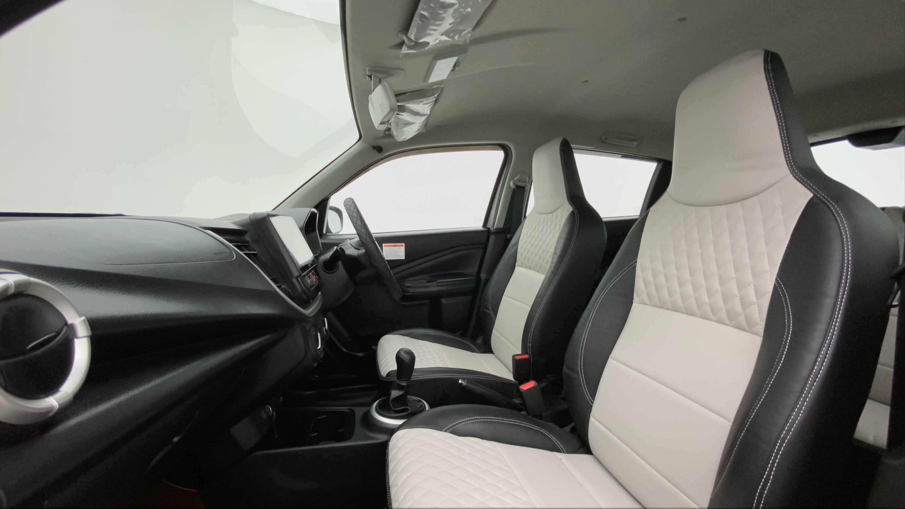 Interior front seats and dashboard of a Maruti Suzuki Celerio