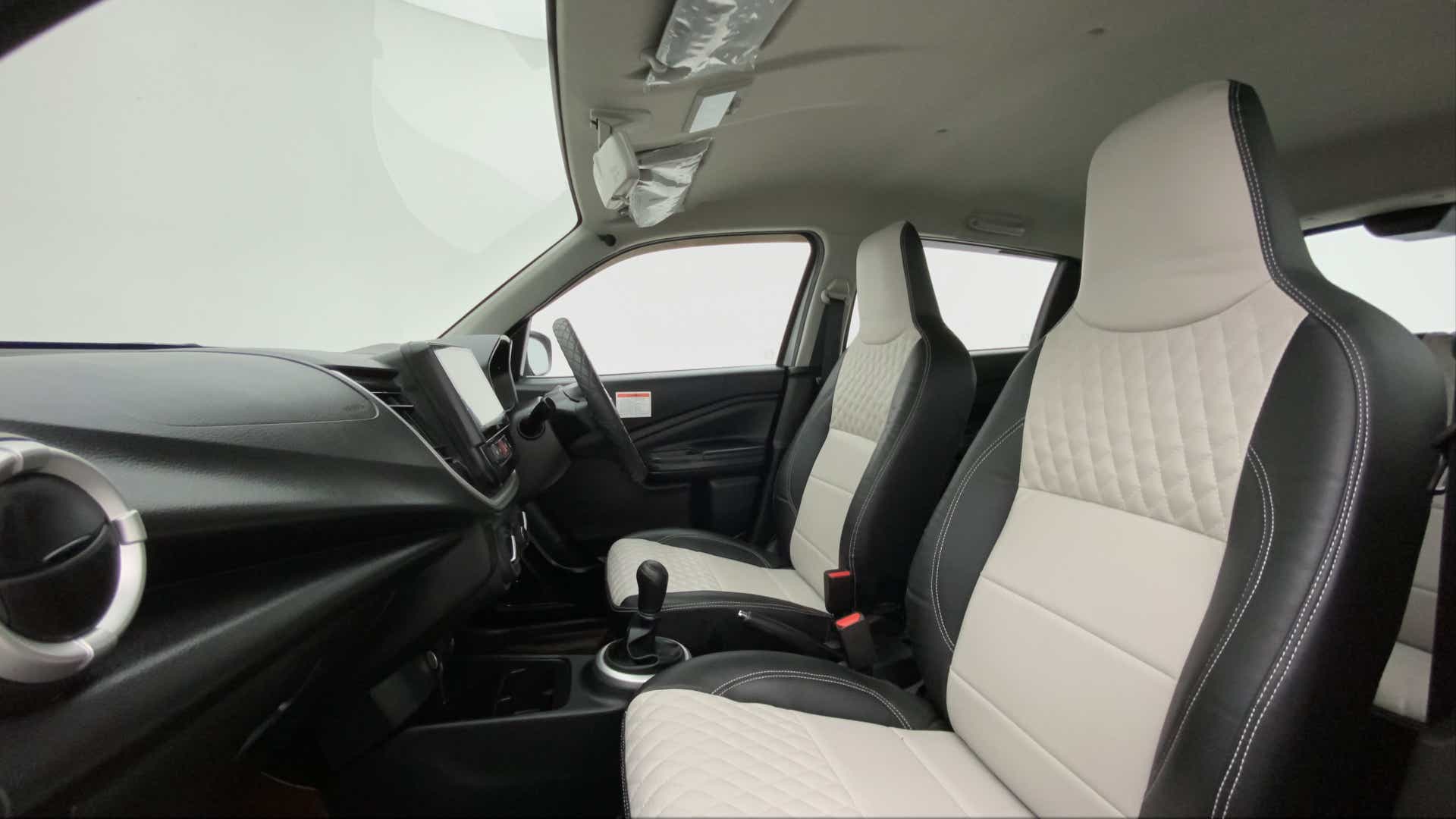 Interior front seats and dashboard of a Maruti Suzuki Celerio