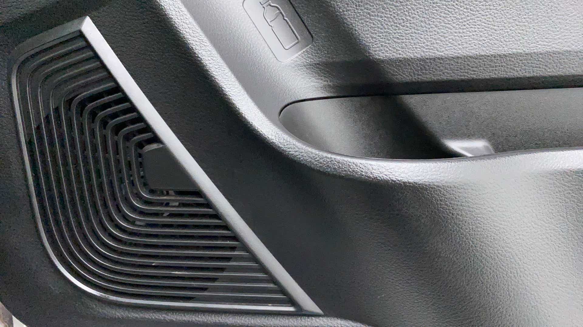 Interior door panel speaker grille of a Maruti Suzuki Celerio