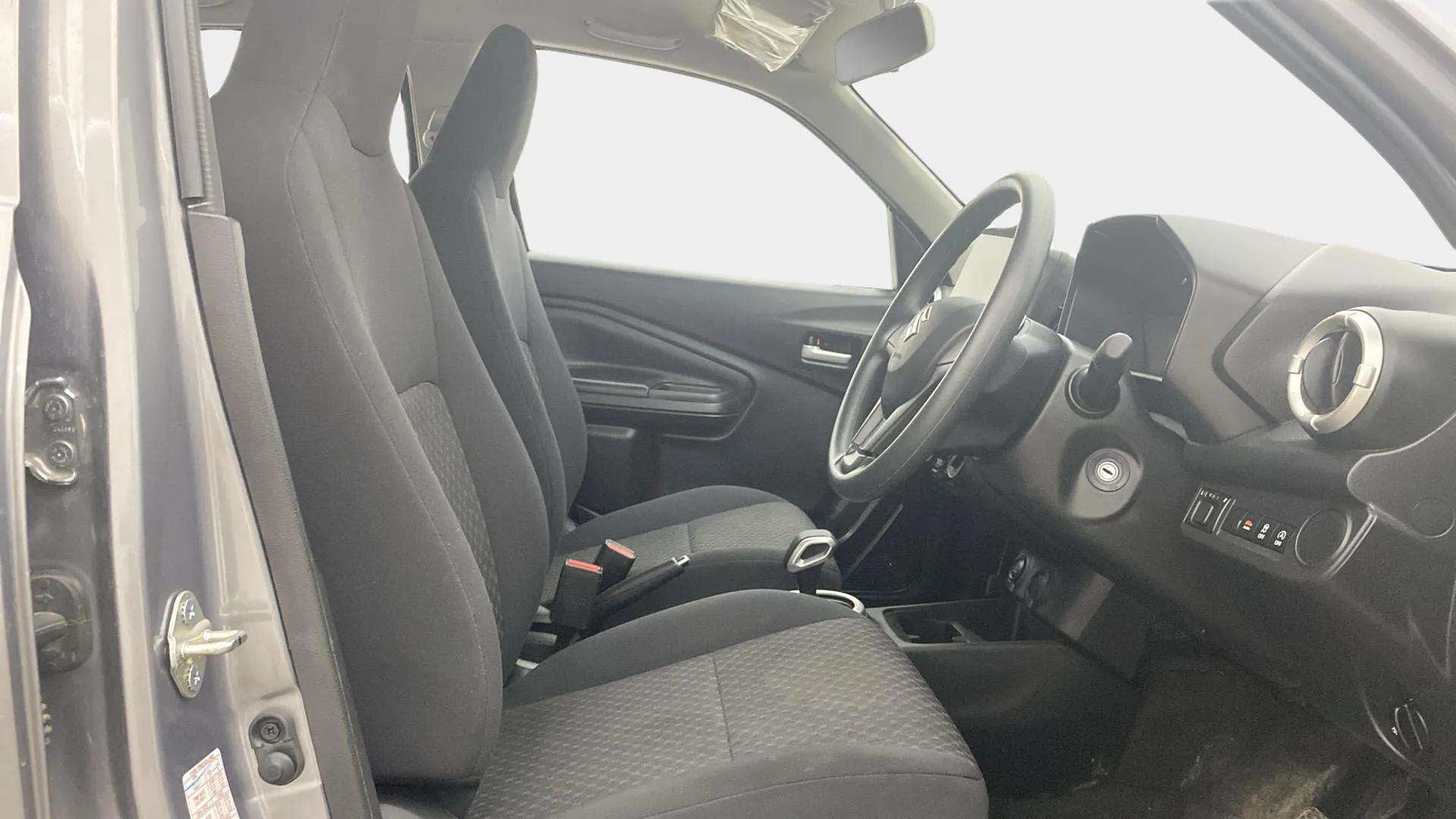 Interior front seats and dashboard of a Maruti Suzuki Celerio