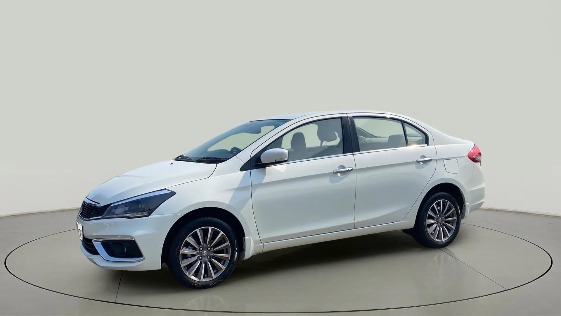 Front three-quarter view of a Pearl Arctic White Maruti Suzuki Ciaz