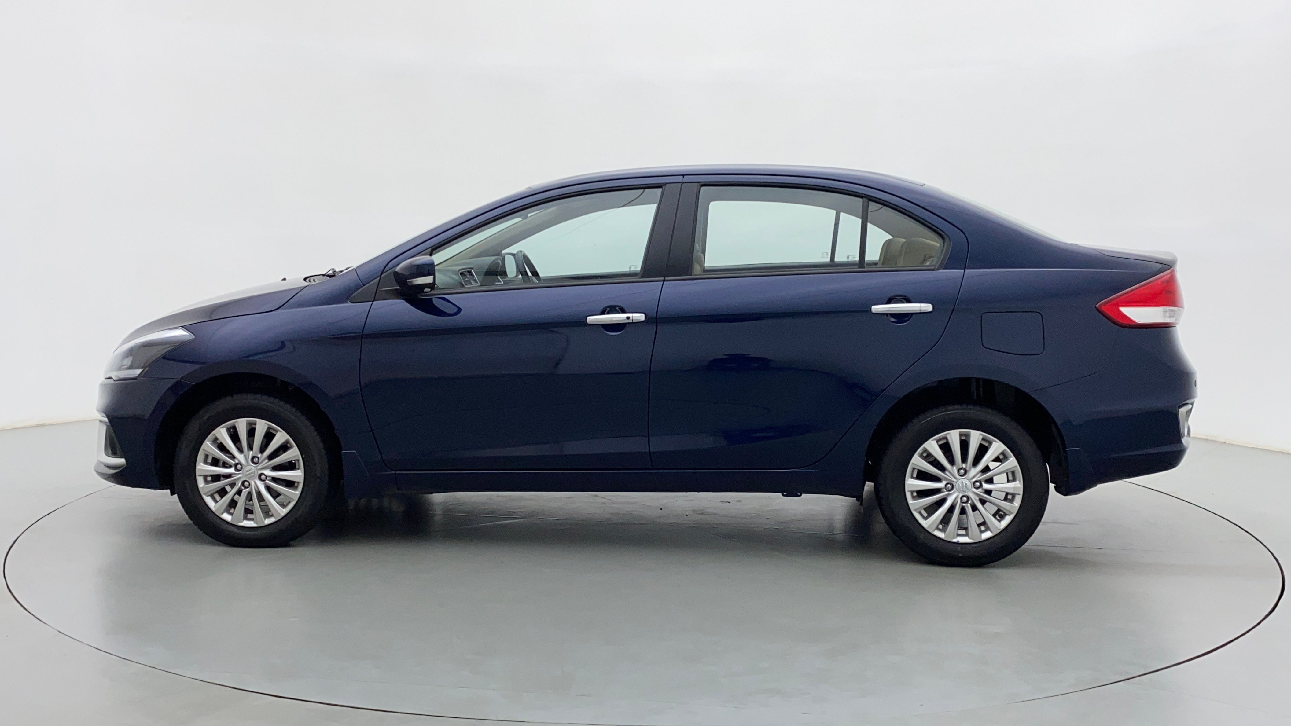 Side view of a Nexa Blue Maruti Suzuki Ciaz