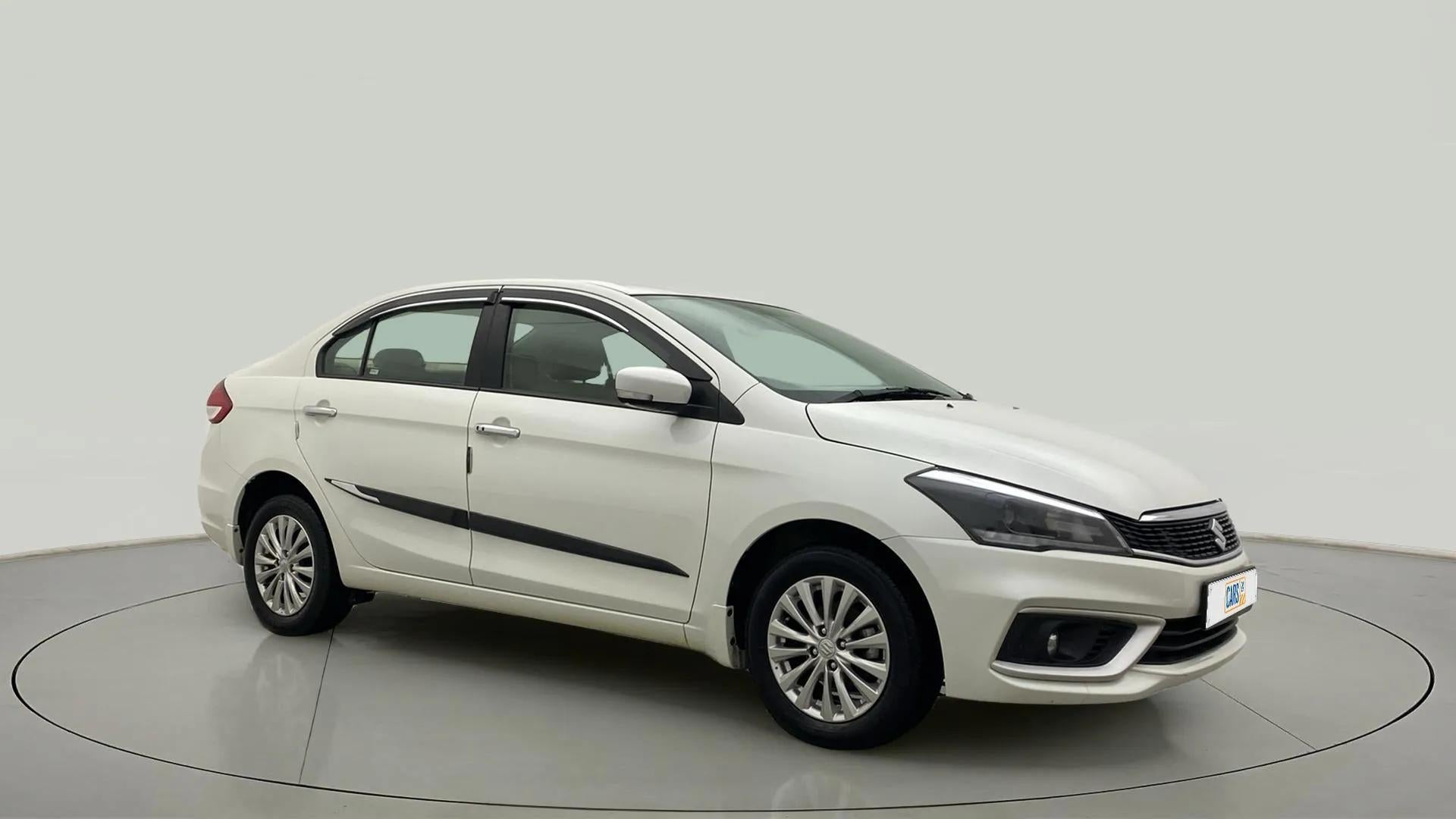 Front side view of a Pearl Arctic White Maruti Suzuki Ciaz