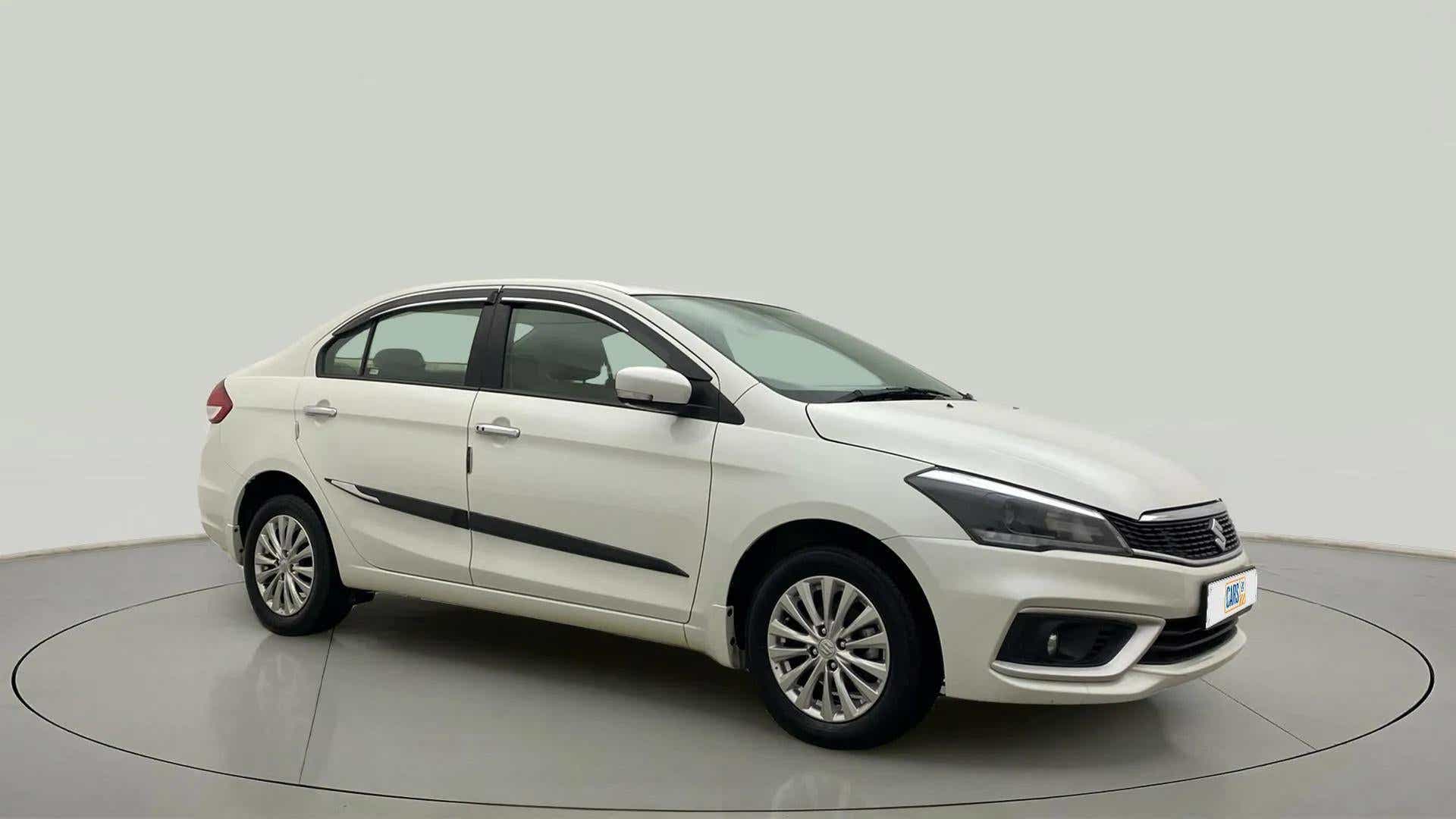 Front side view of a Pearl Arctic White Maruti Suzuki Ciaz
