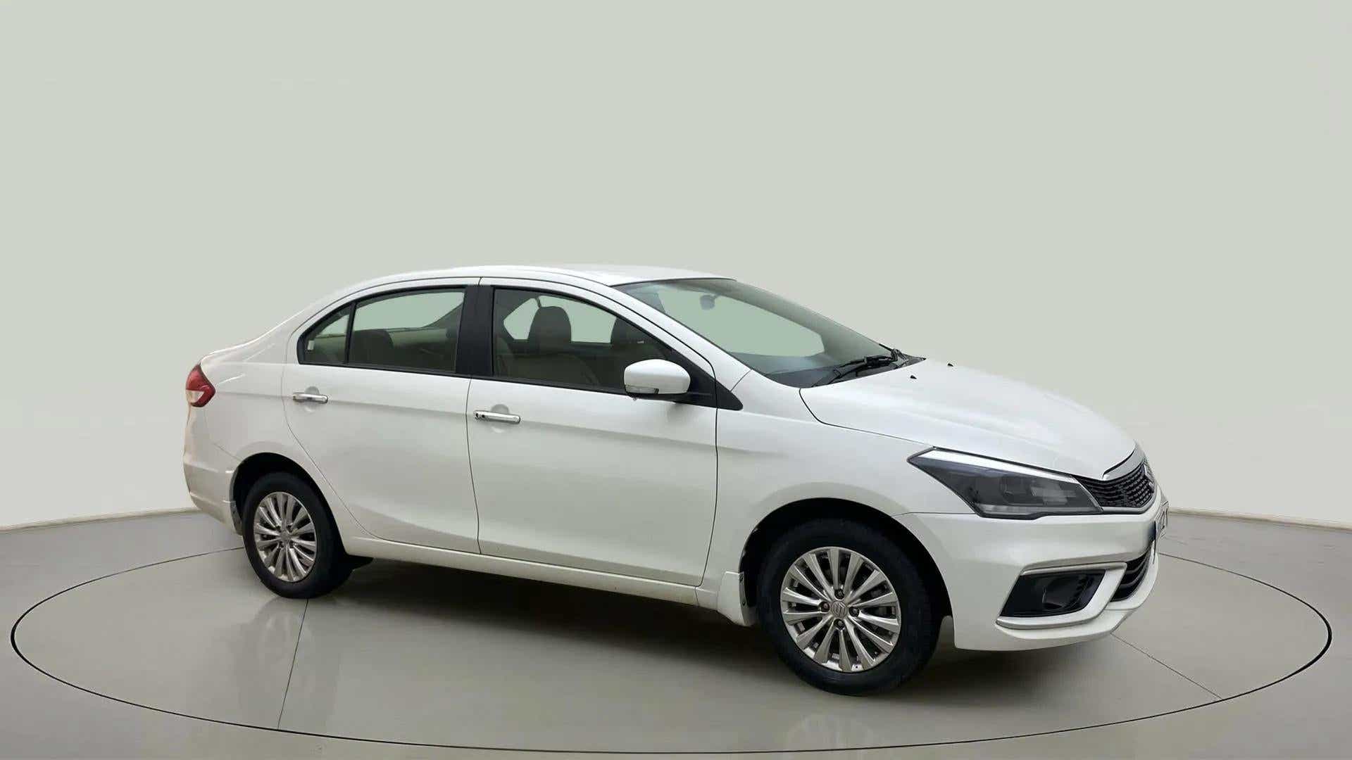 Side view of a Pearl Arctic White Maruti Suzuki Ciaz