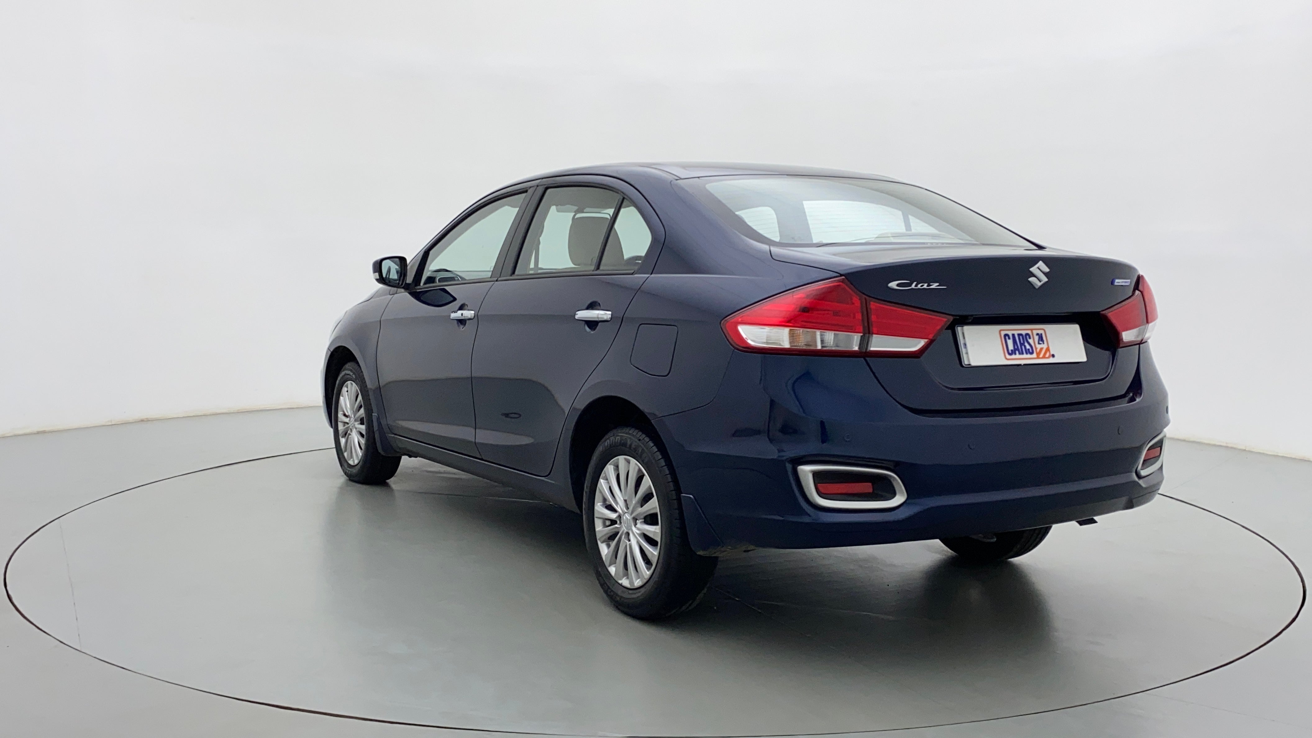 Rear three-quarter view of a Nexa Blue Maruti Suzuki Ciaz