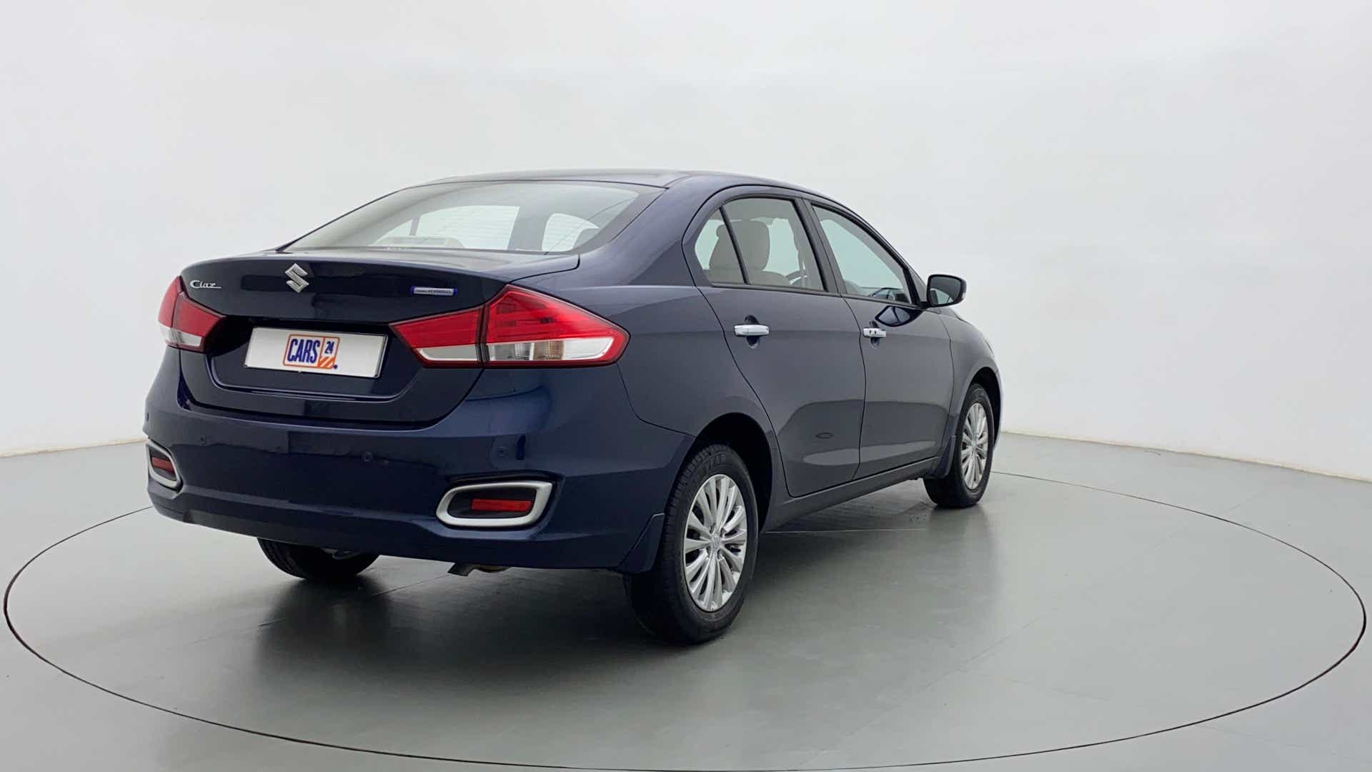 Rear three-quarter view of a Nexa Blue Maruti Suzuki Ciaz