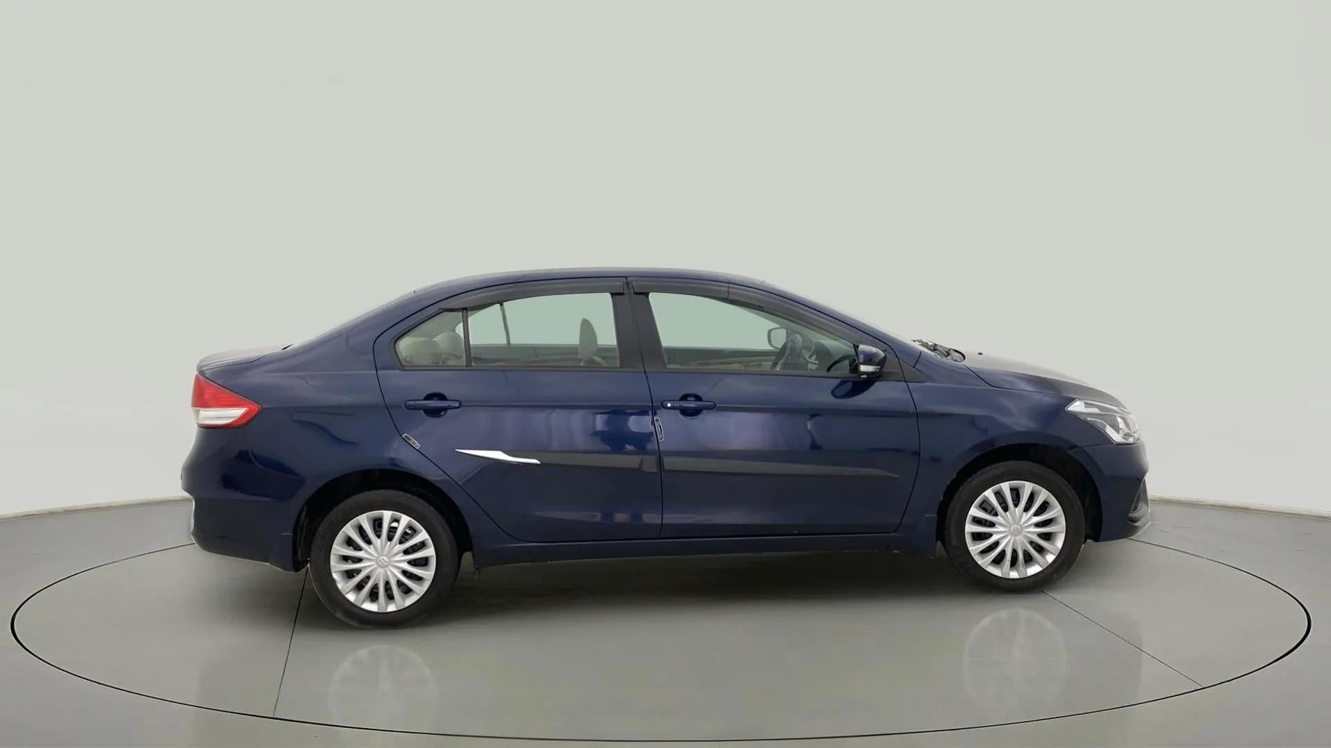 Side view of a Nexa Blue Maruti Suzuki Ciaz