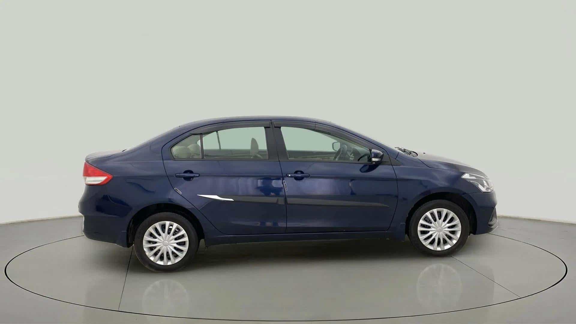 Side view of a Nexa Blue Maruti Suzuki Ciaz
