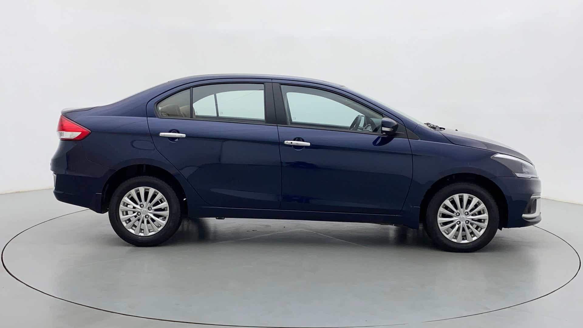 Side view of a Nexa Blue Maruti Suzuki Ciaz