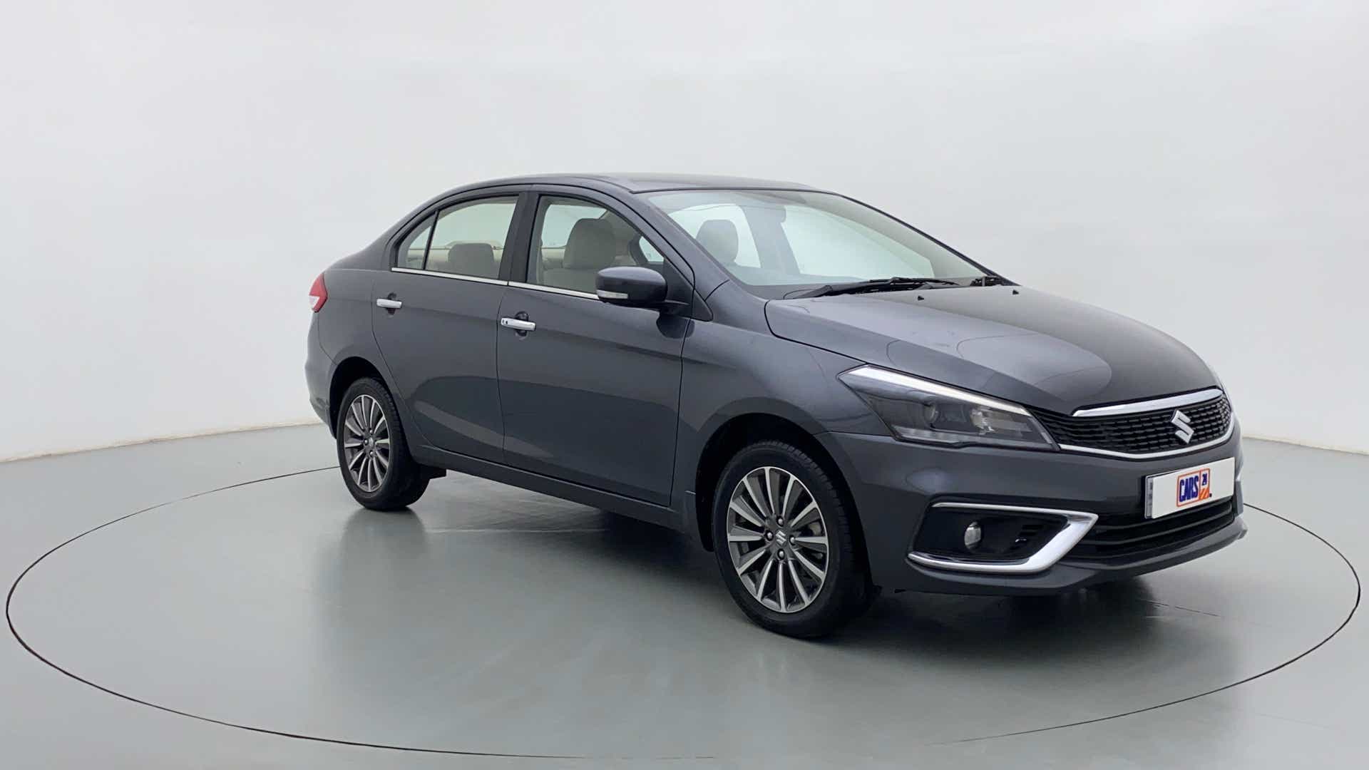 Front three-quarter view of a Grandeur Grey Maruti Suzuki Ciaz