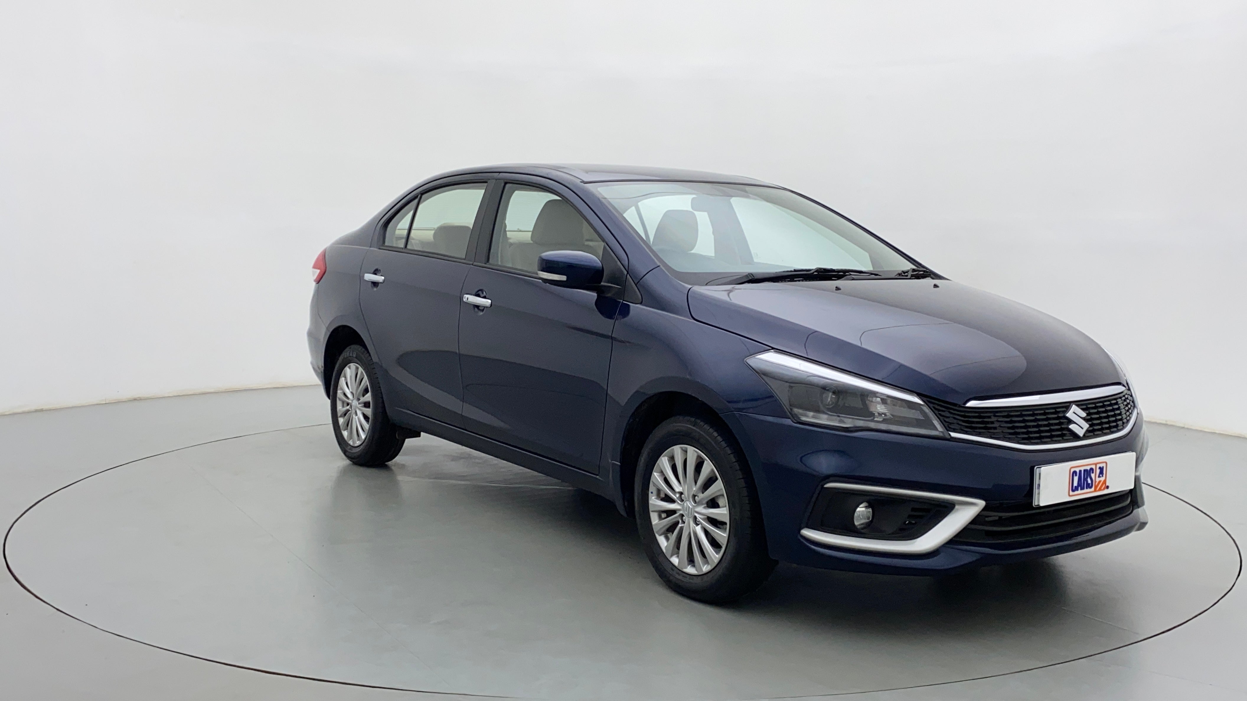Front three-quarter view of a Nexa Blue Maruti Suzuki Ciaz