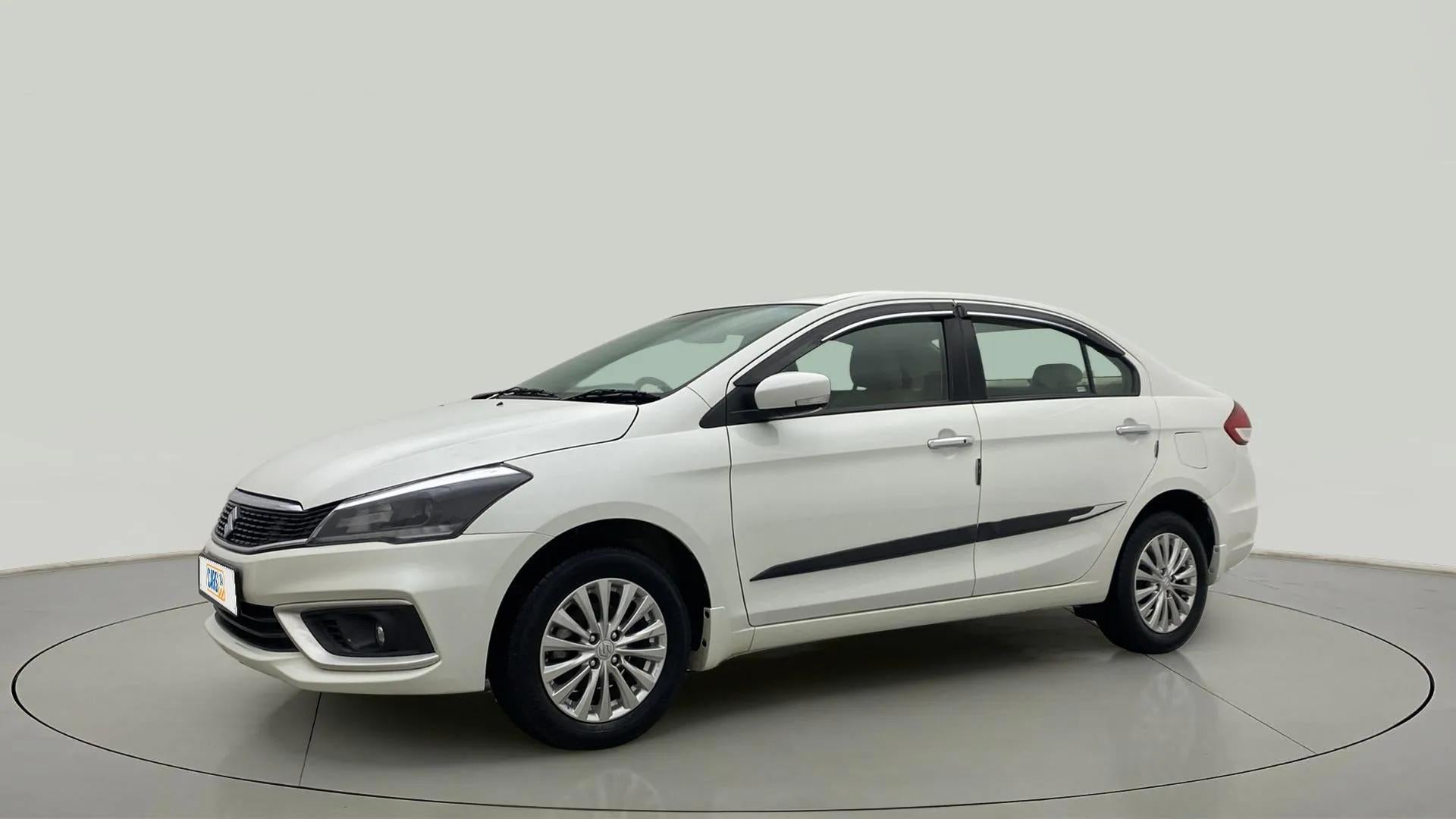 Front three-quarter view of a Pearl Arctic White Maruti Suzuki Ciaz