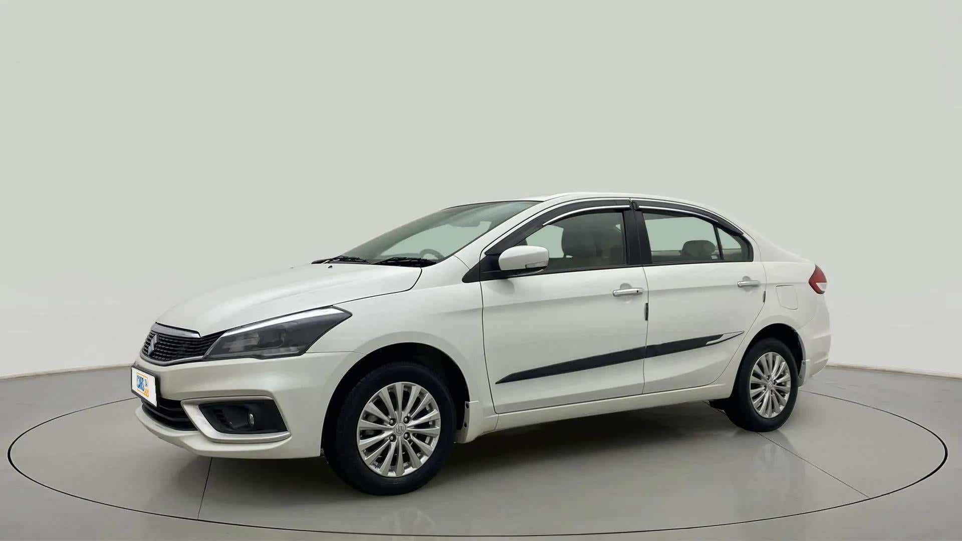 Front three-quarter view of a Pearl Arctic White Maruti Suzuki Ciaz